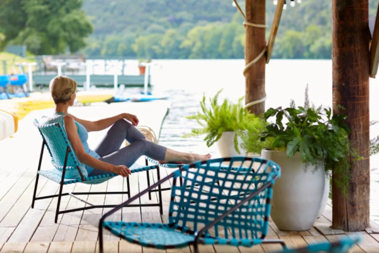 Floating dock with woman gazing lake austin spa resort